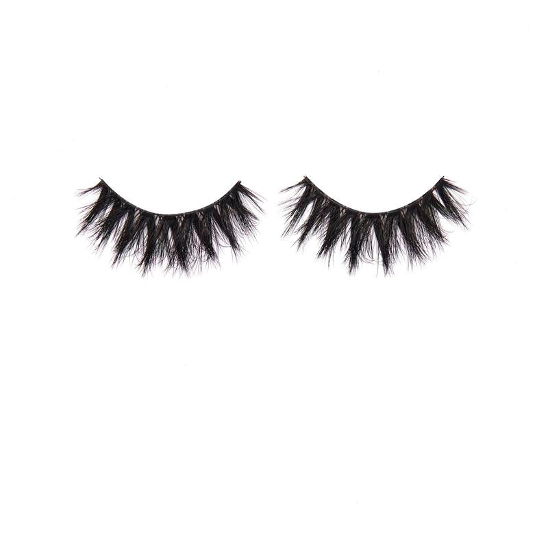 Pair of black false eyelashes on a white background