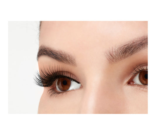 A model wearing Ardell 3D Faux Mink 857 in a side view emphasizes the curly, flared & natural lash look
