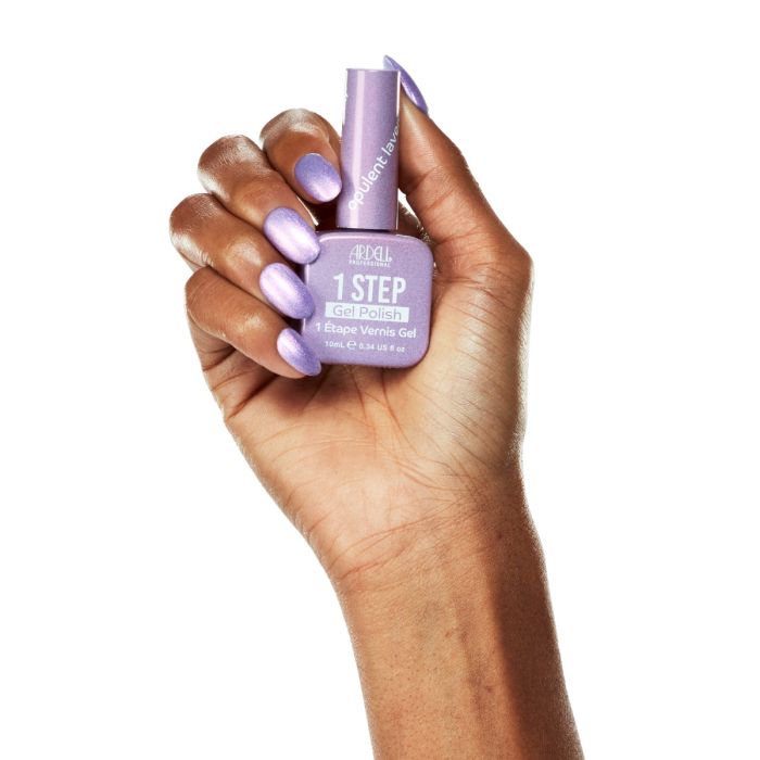 Model hand in Ardell Opulent Lavender polish, showcasing a pastel purple-pink shimmer for a chic nail look.