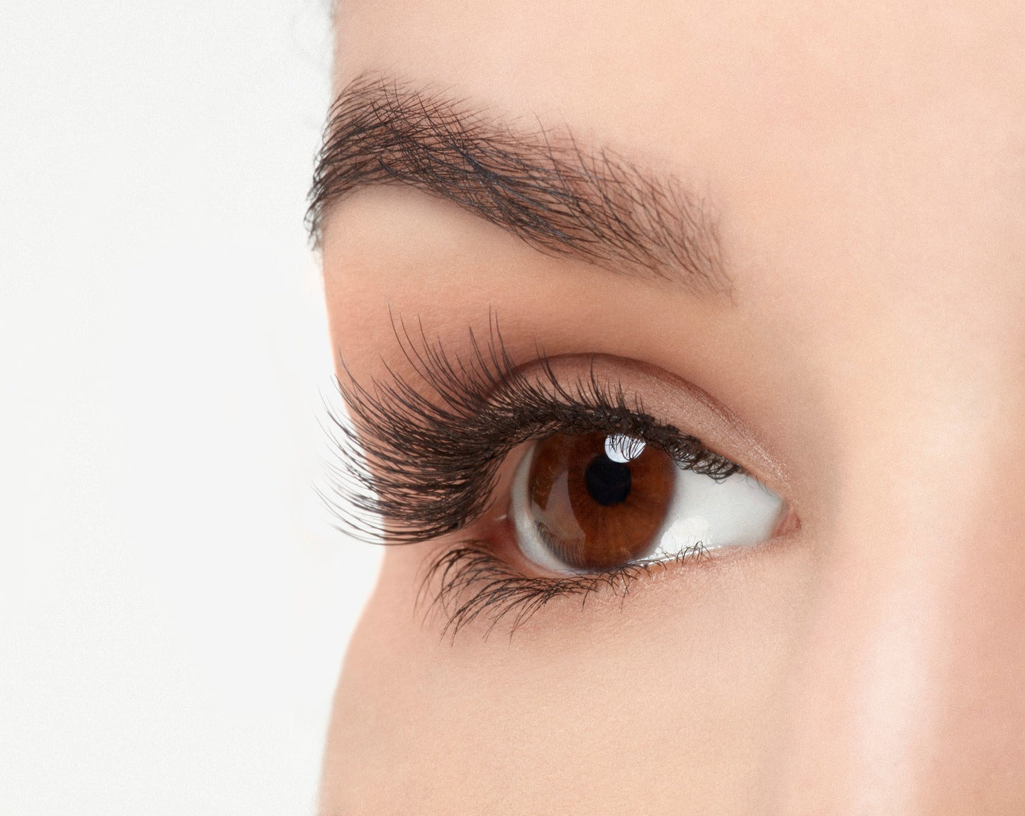 Angled right eye of a model wearing Ardell Pre-Cut Lashes 901 showing its curly and flares faux lash
